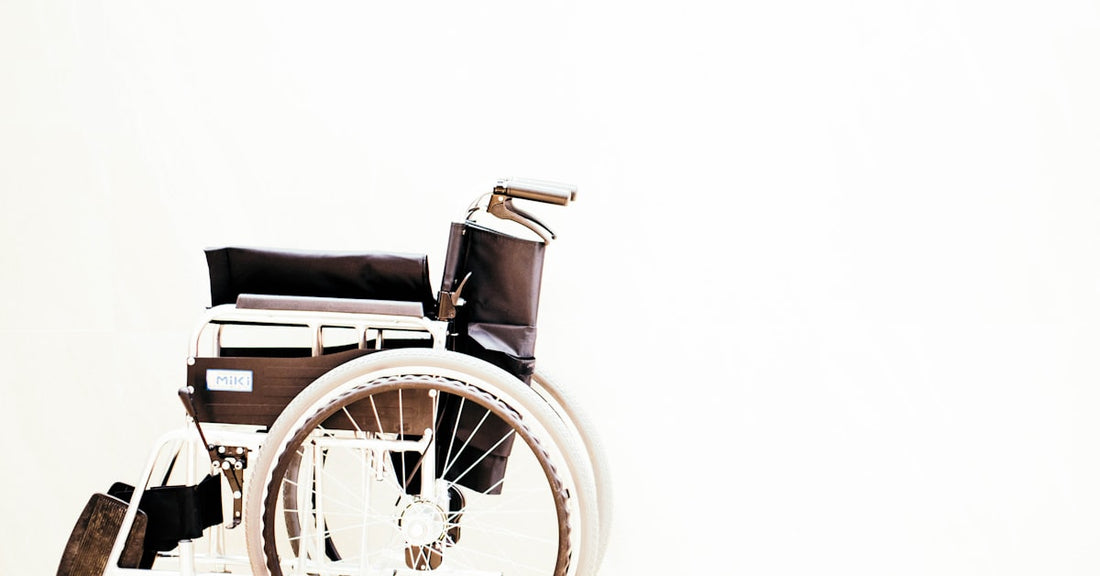 Wheelchair user with limited mobility receiving healthcare